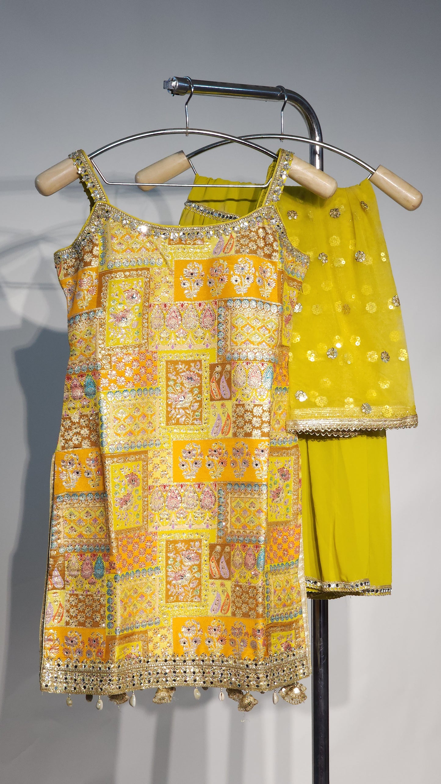 Stunning yellow embroidery sleeveless sharara set