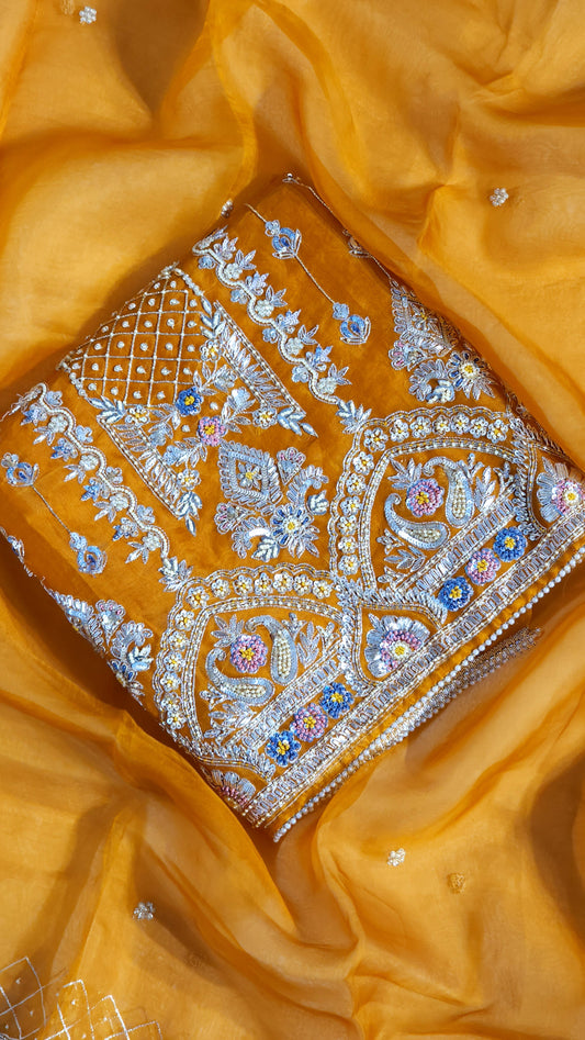 Orange shade suit with Zari work designed